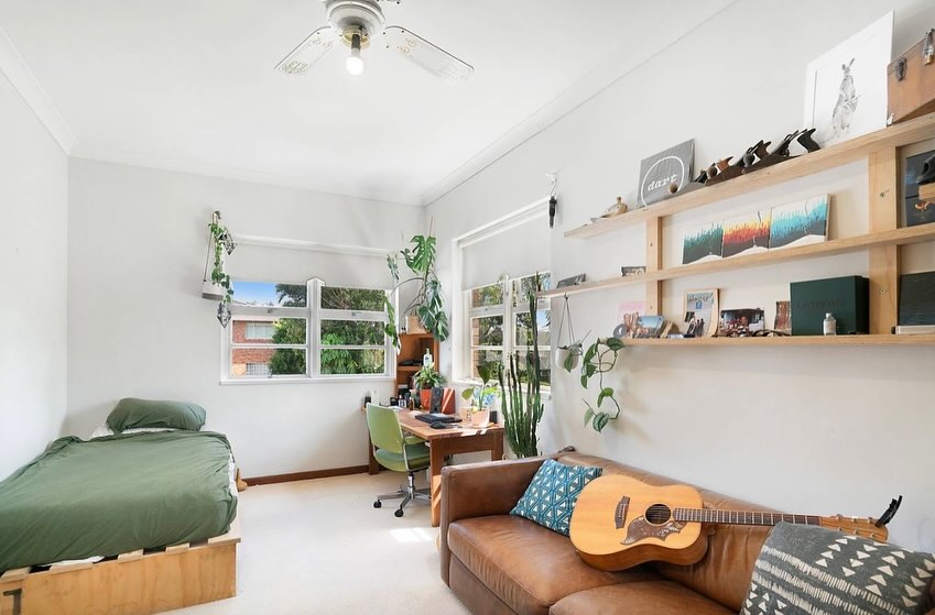 Studio bedroom with clean white wall repaint