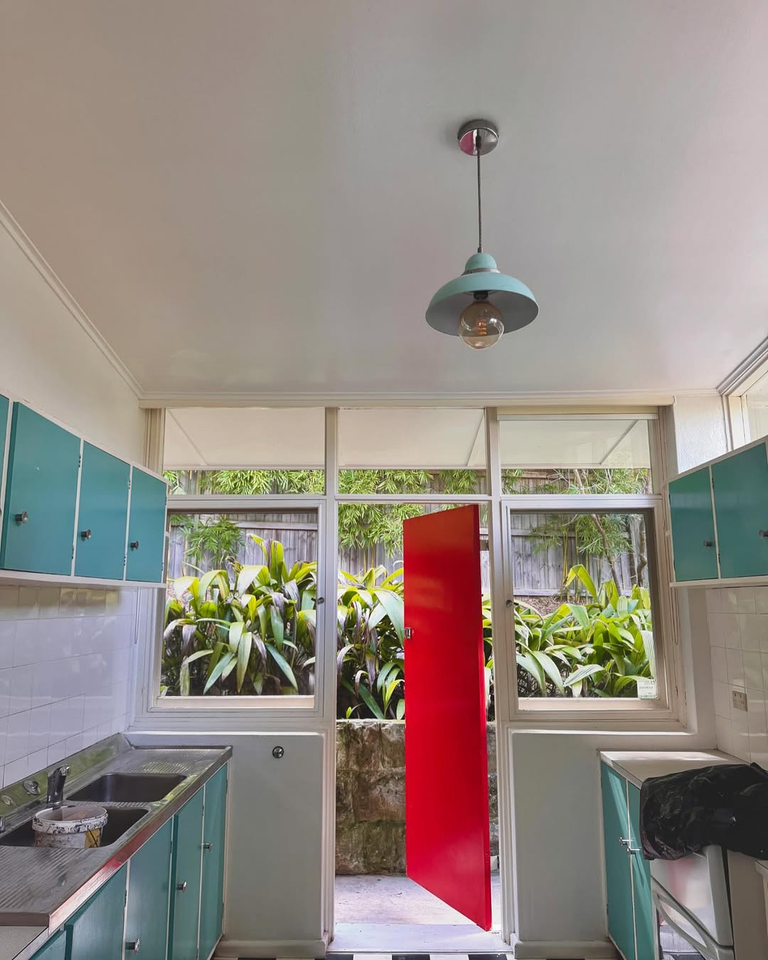 Kitchen repaint with retro teal cabinetry and freshly painted ceiling