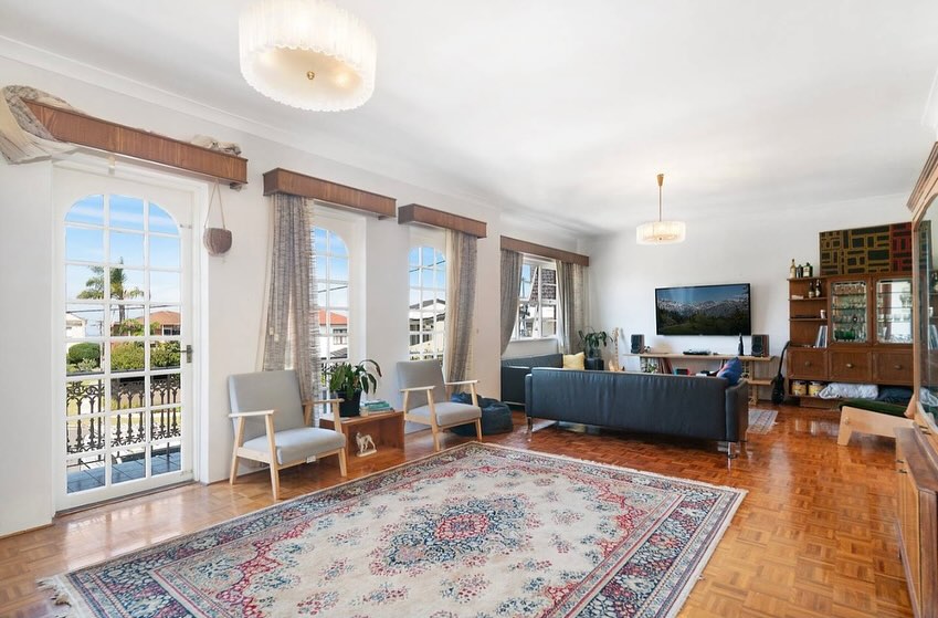 Period home living room with freshly painted walls and parquet floors
